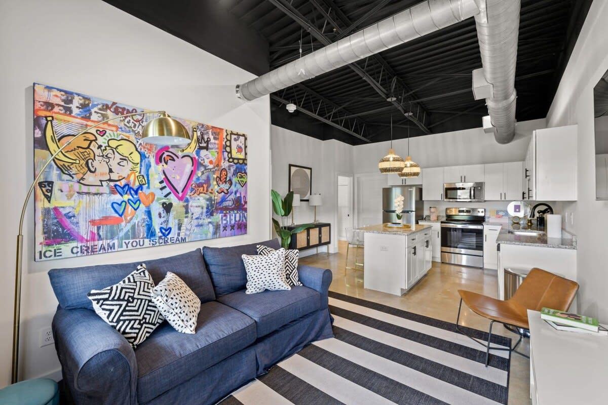 The pop-art living room at Audrey's Loft, five minutes from the airport