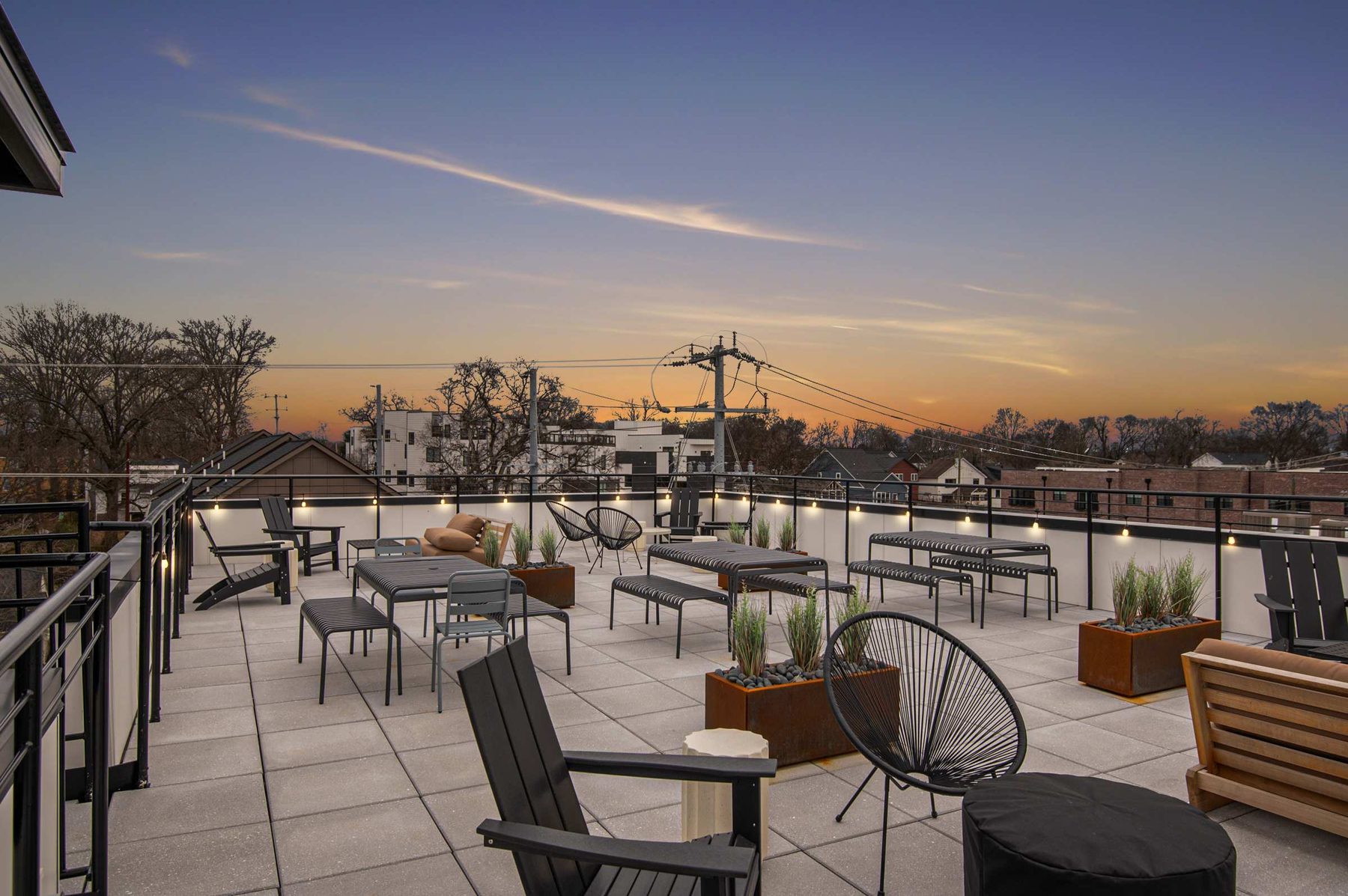 A rooftop deck at sunset over East Nashville