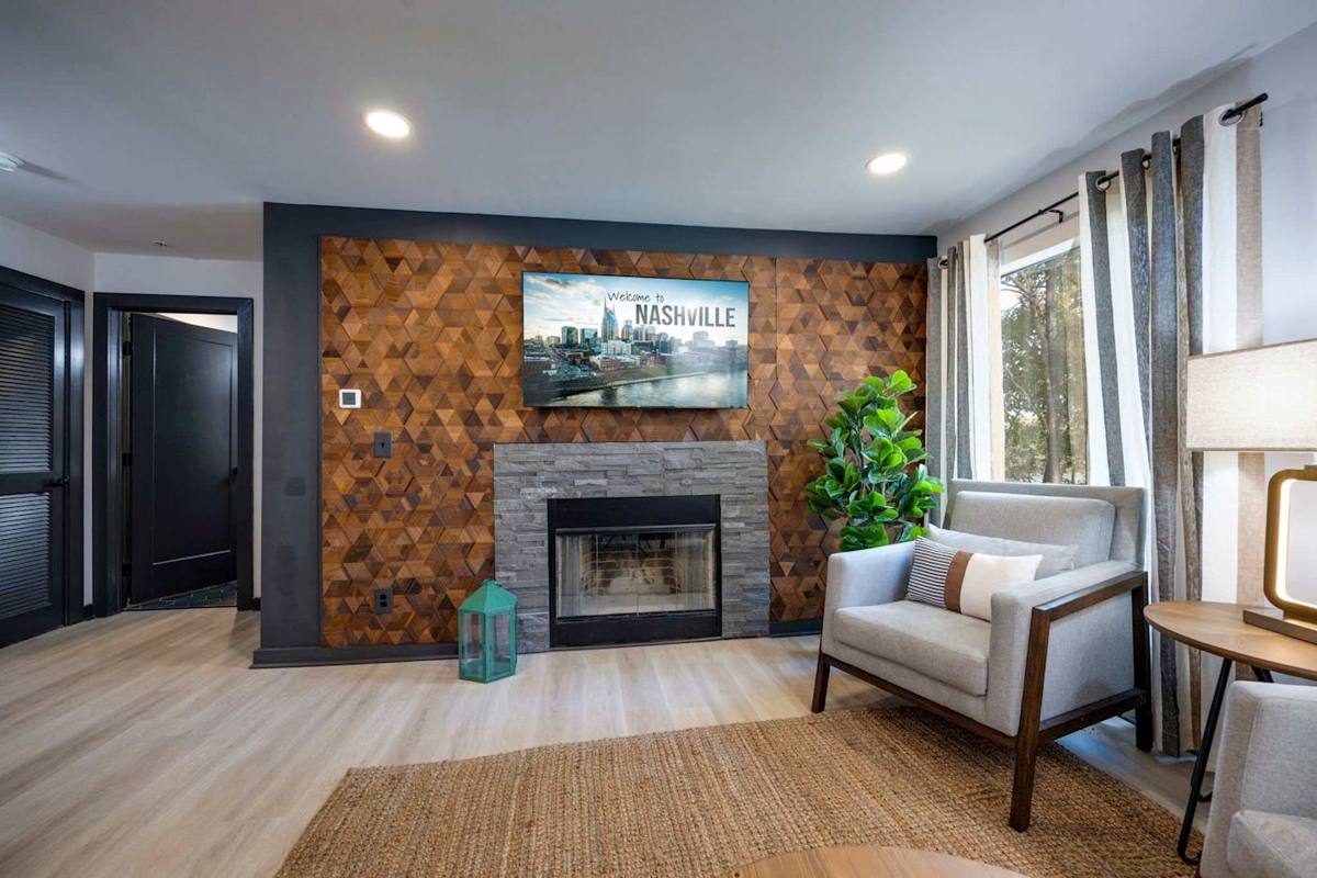 Relax in style with vibrant decor, a warm fireplace, and views of Nashville!