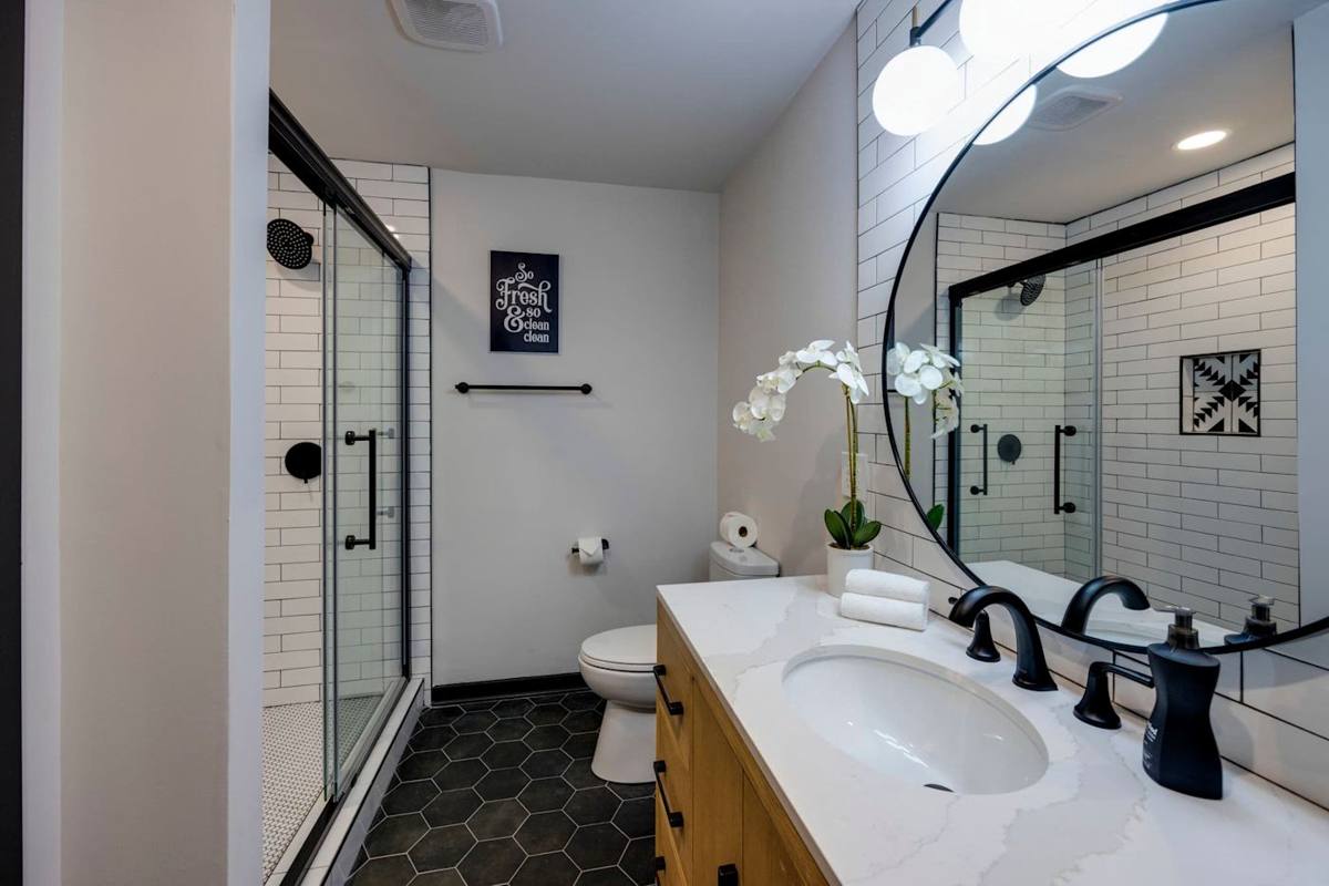 Modern elegance meets tranquility with a chic shower and stylish decor!