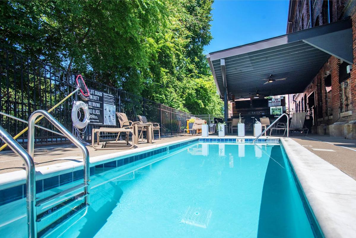 Poolside Retreat: Dive into relaxation by the sparkling pool surrounded by lush greenery!