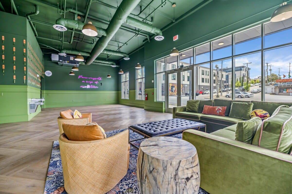Vibrant hues of green saturate this neo-styled living room, creating an energizing and refreshing atmosphere. Sink into the sumptuous couches and gather around the modern coffee table to enjoy lively conversations and moments of relaxation.