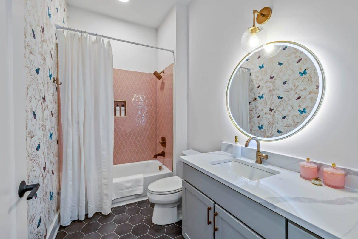 Embark on a journey into vintage charm with our pink and white tiled floor design. Enter a bathroom that pays homage to bygone eras, seamlessly merging timeless style with modern functionality. Indulge in a space that whispers of elegance and nostalgia.