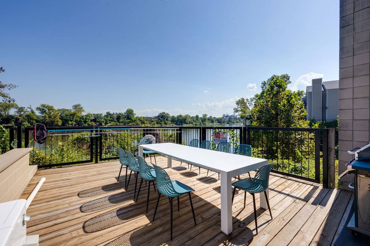 Sip cocktails with panoramic river views at this stunning outdoor oasis!