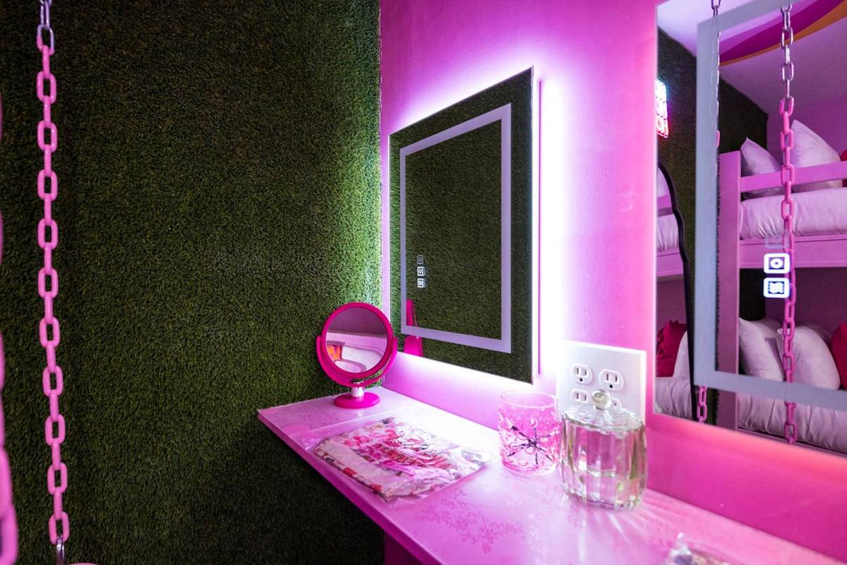 Vibrant decor with lush greenery and playful lighting for a refreshing retreat!