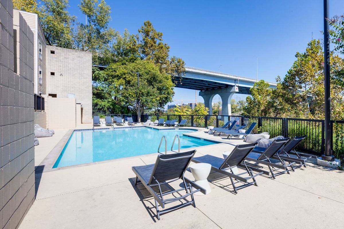 Relax by the sparkling pool with lounge chairs and vibrant Nashville vibes!