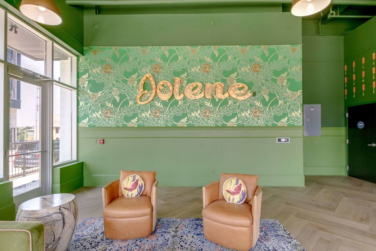 Dive into the vibrant charm of Nashville with colorful decor and comfy seating!