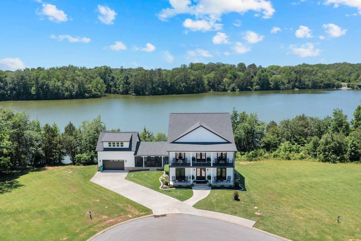 Stunning lake views await! Relax on the porch and soak in nature's beauty.