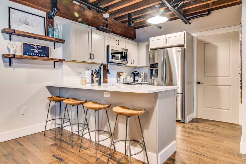 Sleek design and modern appliances make cooking fun in this stylish space!