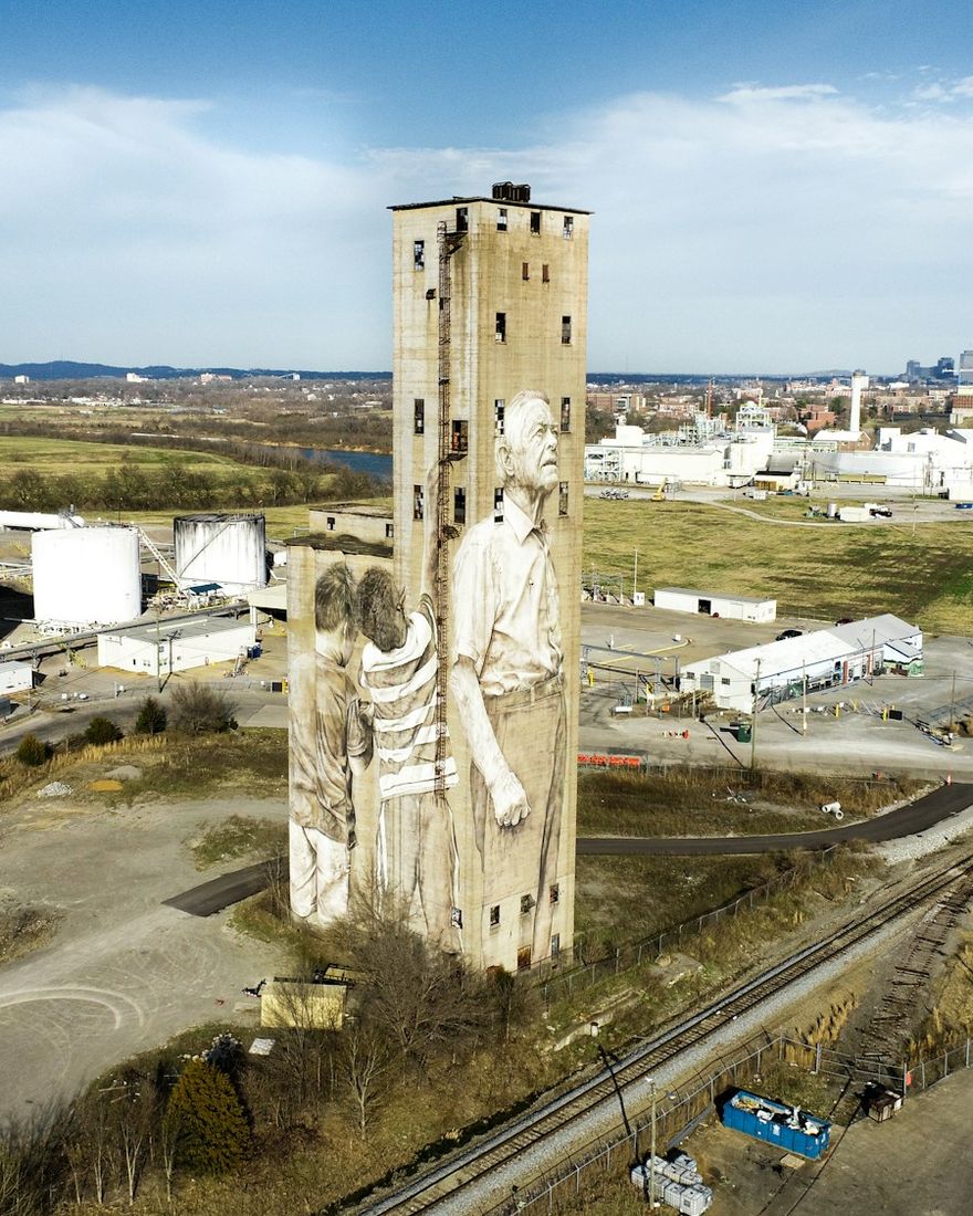 The painted grain silos in The Nations, seen from the air with the skyline behind